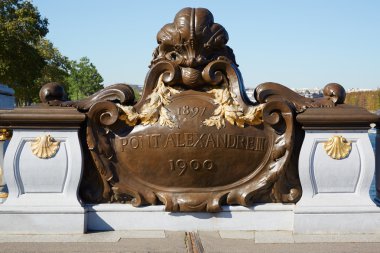 Pont Alexandre III bridge balustrade emblem in Paris