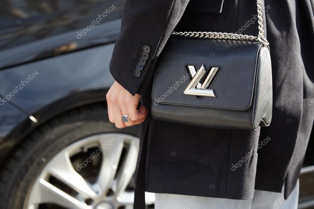 Linda Tol with Louis Vuitton twist lock black bag before Emporio