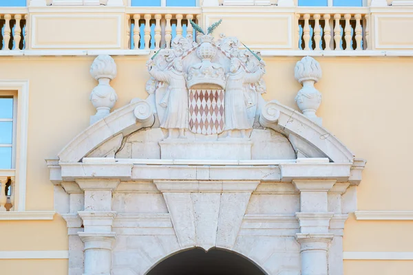 Monaco Prince 's Palace with coat of arms over the entrance in a summer day — стоковое фото