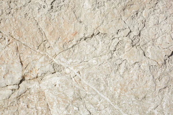 Warm witte steen textuur achtergrond in zonlicht — Stockfoto