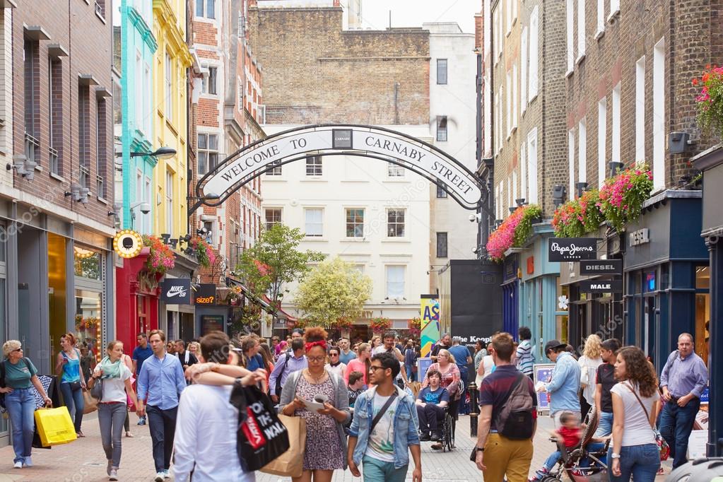 Carnaby street, shopping street with people in London Stock Editorial