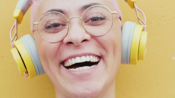 Portrait Smiling Young Woman Headphones Eyeglasses Stock Footage