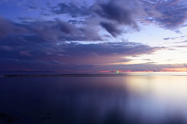 Dramatic rain cloud,sea and sky at dusk.Long exposure technique — Stock Photo, Image