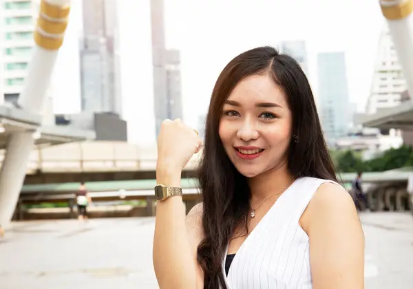 Beautiful Asia woman smile portrait on walking street.