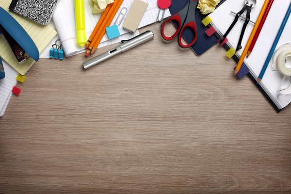 Desk cluttered with office supplies — Stock Photo, Image