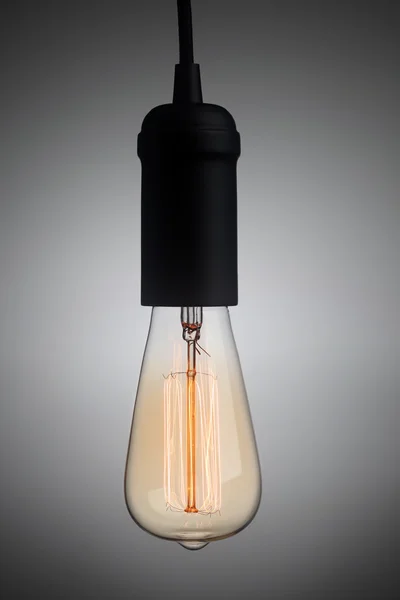 Vintage light bulb glowing — 图库照片