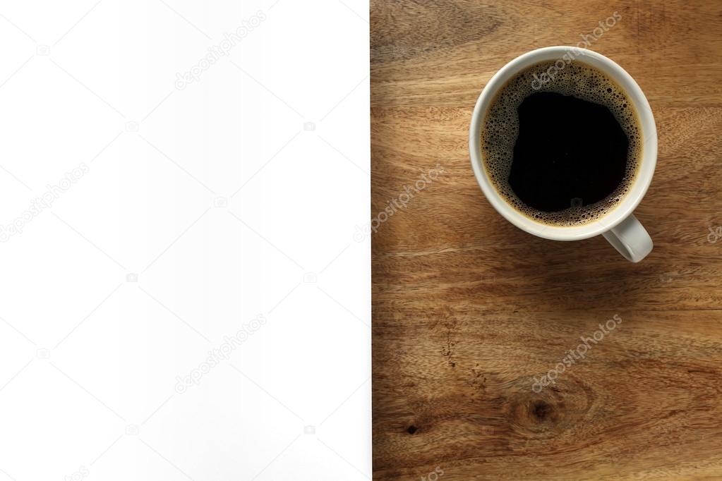 Cup of coffee on desk with white space