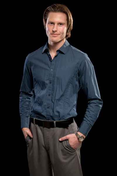 Muž v modré košili a kalhoty šedé Stock Fotografie