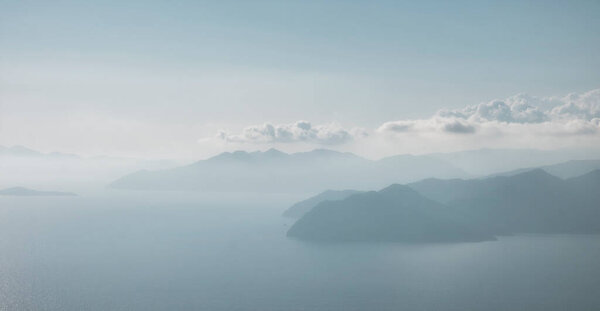 View of the Greek island of Rhodes in the Aegean Sea from the top of the mountains on the Turkish side of the city of Dalyan.