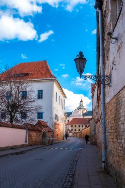 vintage lanterns on  narrow streets overlooking the temple of old Vilnius Lithuania  