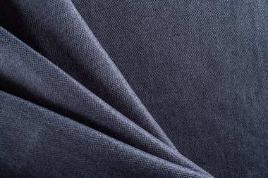 Yoğun döşeme kumaşı koyu mavi, katlanmış kumaş.