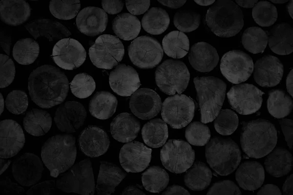 Abstract black background with row of logs texture — Stock Photo, Image