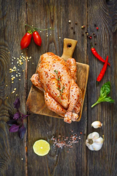 Preparation for roasting chicken with herbs — Stock Photo, Image