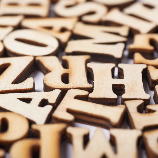 Surface covered with wooden letters — Stock Photo, Image