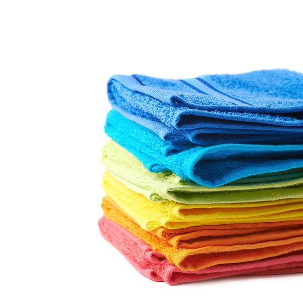 Pile of rainbow colored towels isolated — Stock Photo, Image