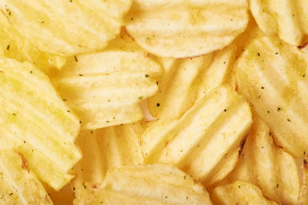 Oppervlak bedekt met aardappel chips — Stockfoto