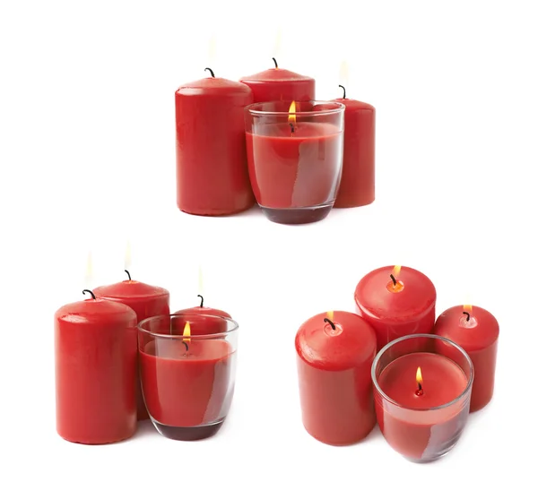 Quatro velas vermelhas acesas isoladas — Fotografia de Stock