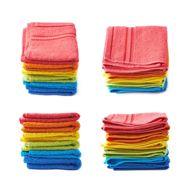 Pile of rainbow colored towels isolated — Stock Photo, Image