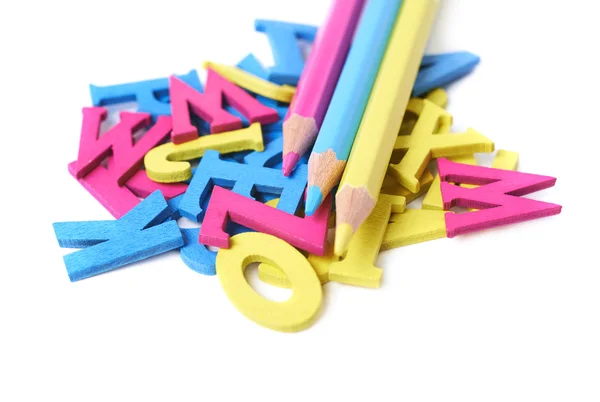 Pile of painted wooden letters isolated — Stock Photo, Image