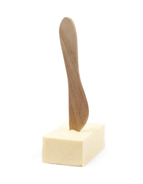 Couteau sur un morceau de beurre isolé — Photo