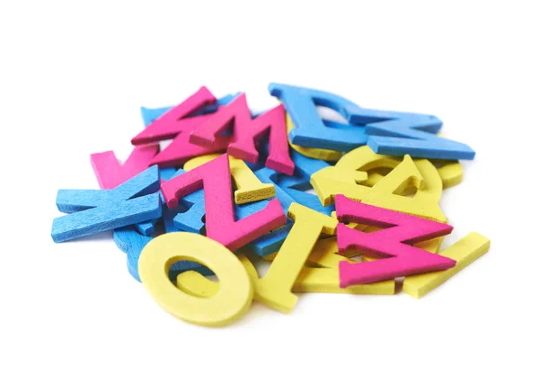 Pile of painted wooden letters isolated — Stock Photo, Image