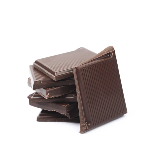 Pile de morceaux de barres de chocolat isolés — Photo