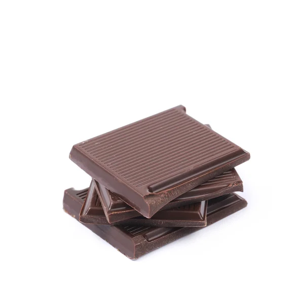 Pilha de pedaços de barra de chocolate isolado — Fotografia de Stock