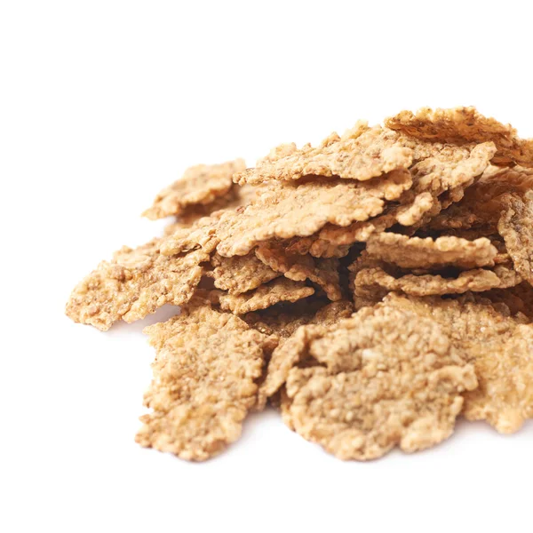 Pile of wholegrain cereal flakes isolated — Stock Photo, Image