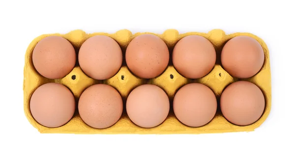 Żółty jajko karton na białym tle — Zdjęcie stockowe