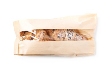 Fresh croissant in a paper bag clipart