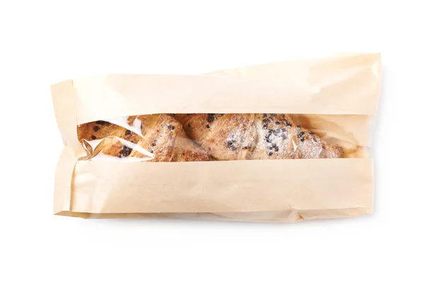 Fresh croissant in a paper bag — Stock Photo, Image