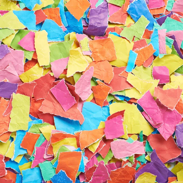 Superfície coberta com pedaços de papel — Fotografia de Stock