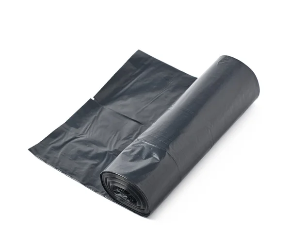 Bolso de basura negro rollo aislado — Foto de Stock