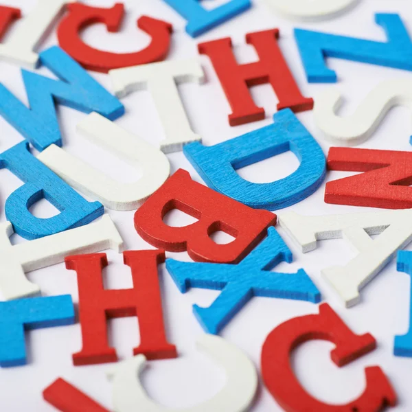 Oberfläche mit den Holzbuchstaben bedeckt — Stockfoto