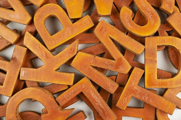 Oberfläche mit mehreren Holzbuchstaben beschichtet — Stockfoto