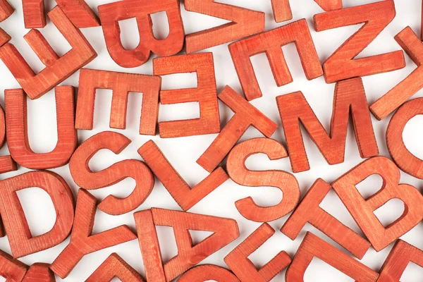 Oberfläche mit mehreren Holzbuchstaben beschichtet — Stockfoto