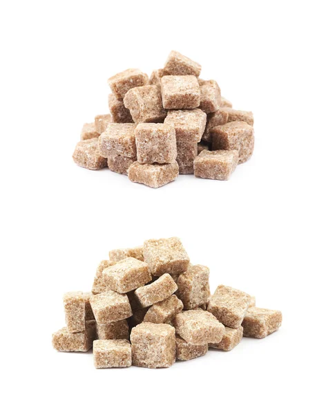 Pile of brown sugar cubes isolated — Stock Photo, Image
