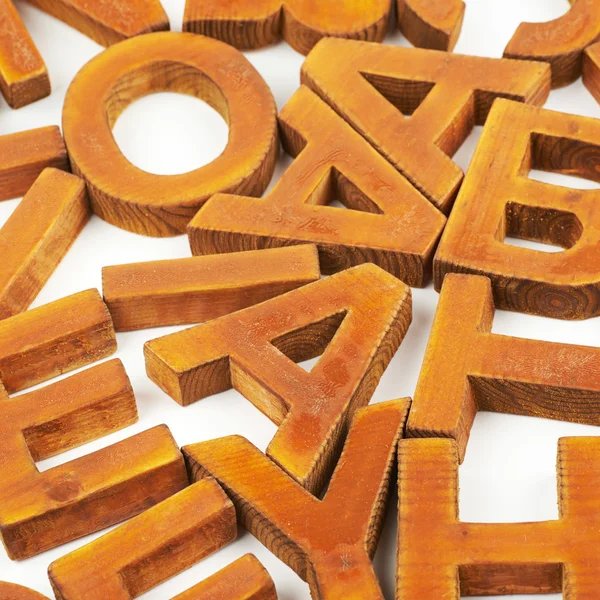 Povrch potažený několika dřevěných písmen — Stock fotografie
