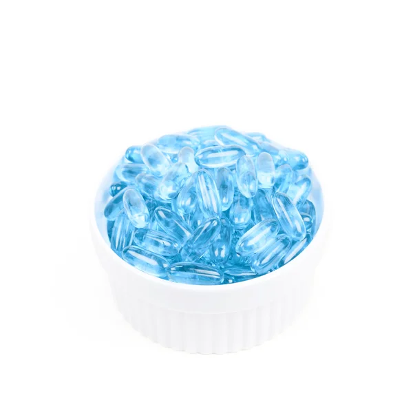 Miska z pigułki niebieski softgel — Zdjęcie stockowe