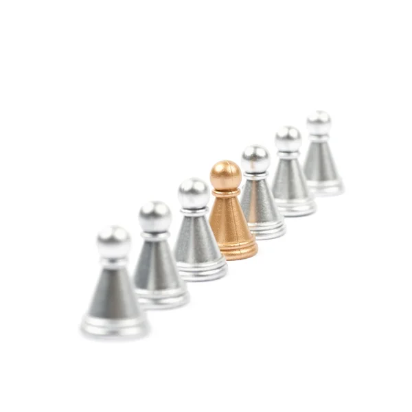 Line of silver and golden pawns isolated — Stock Photo, Image