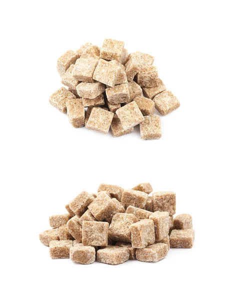 Pile of brown sugar cubes isolated — Stock Photo, Image