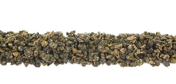 Line of dried green tea isolated — Stock Photo, Image