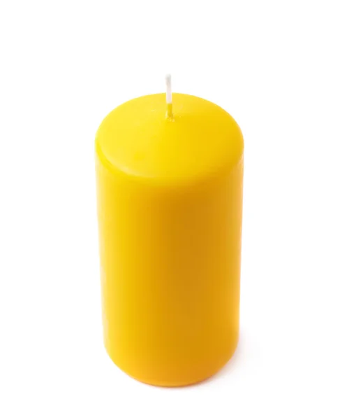 Single yellow wax candle isolated — Stock Photo, Image