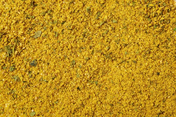 Surface covered with yellow curry — Stock Photo, Image