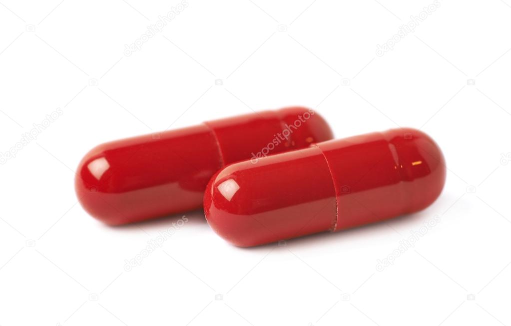 Пил ля. Красные капсулы. Красная таблетка. Лекарство в красных капсулах. Красные капсулы на белом фоне.