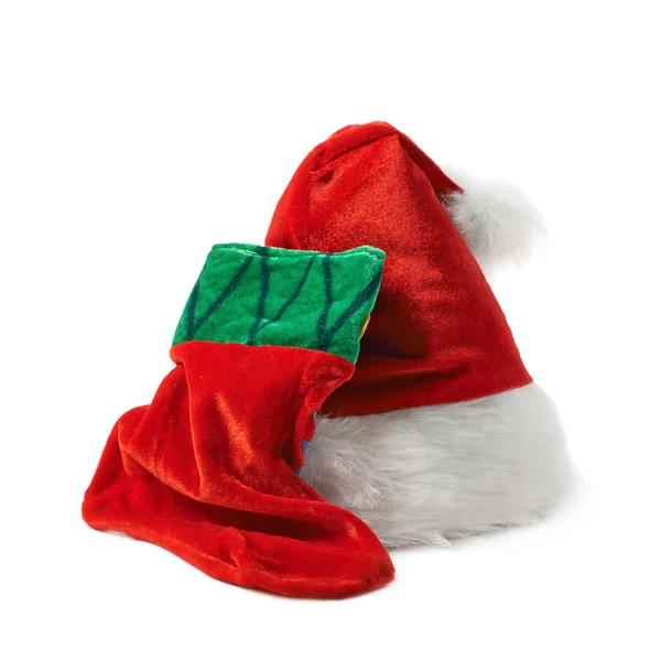 Santas hatt och Julstrumpa isolerade — Stockfoto