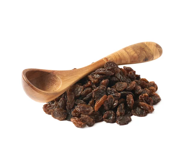 Wooden spoon over the pile of raisins Stock Image