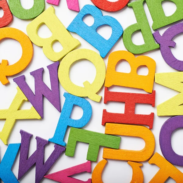 Surface covered with colorful letters — Stock Photo, Image