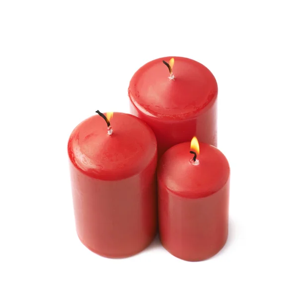 Trois bougies rouges brûlantes isolées — Photo