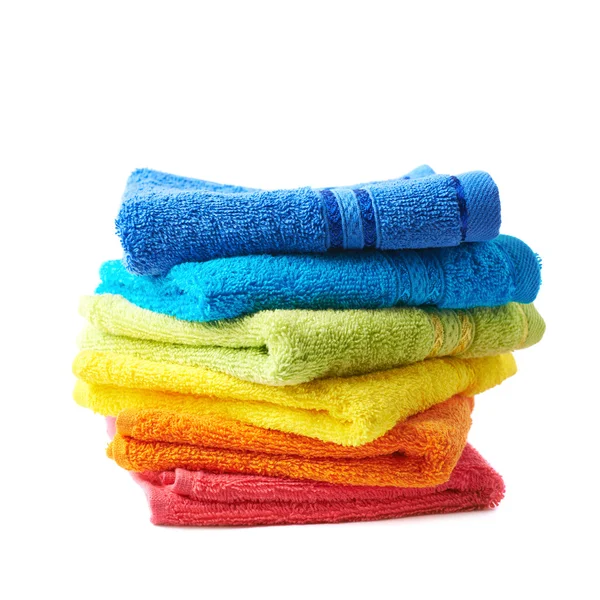 Pile of rainbow colored towels isolated — Stock Photo, Image